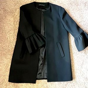 Zara black top coat with ruffled 3/4 sleeves.